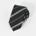 Detailed close-up view of the black and white striped formal business necktie fabric texture. - Black