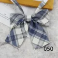Detailed view of the blue and white plaid JK uniform bow tie, cute school style accessory. - Color 050