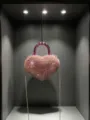 Borsa da sera mini a cuore con strass, cristalli luminosi e manico rosa metallizzato. - Rosa