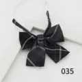 Black plaid JK bow tie with white stripes and adjustable strap, perfect for school uniforms. - Color 035
