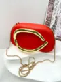 Elegant red leather clutch bag featuring a statement gold metal handle and chain strap detail. - Premium PU Style / Red