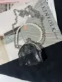 Borsa portamonete vintage in pizzo nero con manico di perle e dettaglio catena in metallo. - Stile Semicerchio Pizzo Nero A123