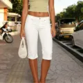 Women's white stretch cropped jeans with split hem detail, casual denim capri pants for summer. - S / White