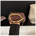 Wine red mini evening crossbody bag featuring a luxury gold abstract metal handle. - Matte Style / Matte Dark Coffee