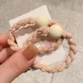 Korean minimalist braided hair scrunchie with round bead, cute pink detail view. - Off White