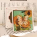 Elegantes Schmetterlings-Lesezeichen aus Metall mit Kette und Anhänger in Geschenkbox für Bücher. - Mit Geschenkbox / Anmutiger Schmetterlingstanz