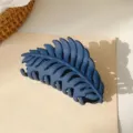 Matte blue leaf hair claw clip detail view, stylish and practical for everyday styling. - Navy Blue