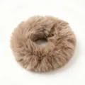 Detailed view of the fluffy plush faux mink hair scrunchie, soft texture for autumn winter. - Brown