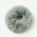 Close-up detail of fluffy faux fur hair scrunchie in soft gray, elegant winter accessory. - Light Green
