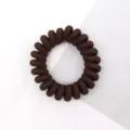 Brown telephone cord hair tie detail, showing the textured fabric wrap and high elasticity. - Brown