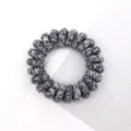 Detailed close-up view of the braided black and white phone cord hair tie, textured surface. - Multicolor Light Black