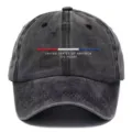 Close-up detail of the washed black baseball cap featuring red white blue embroidery and text. - Black