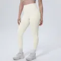 High-waisted solid color yoga leggings detail showing slim fit and perfect shaping effect. - S / Bottoms / Light Ivory
