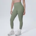 Close-up view of solid color high-waist yoga pants detail, breathable fitness leggings. - S / Bottoms / Cedar Green