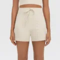 Shorts deportivos beige de tiro alto con cordón ajustable y bolsillos laterales para yoga y gimnasio. - S / Bottoms / Blanco Grisáceo