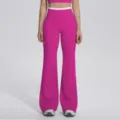 Gros plan sur le pantalon de fitness évasé taille haute, nylon double face, ceinture contrastée. - S / Bas / Fruit du Dragon