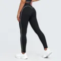 Detail view of black high-waist yoga pants with white contrast piping, naked-feeling fabric. - S / Bottoms / Premium Black