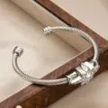 Men's stainless steel twisted cable cuff bracelet with cubic zirconia North Star charm. - Silver