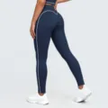 High waist yoga pants detail view showing contrast white piping and hip lifting design. - S / Bottoms / Badge Blue
