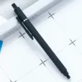Minimalist black retractable gel pen with soft-touch rubberized coating for smooth writing. - Black
