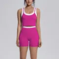 Detailed view of the pink and white colorblock yoga crop top and tight athletic shorts set. - S / Top And Bottom / Dragon Fruit