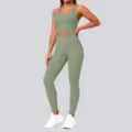 Detail view of the seamless athletic sports bra and high-waisted leggings set in green. - S / Top And Bottom / Basil Green