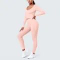 Detailed view of the pink long-sleeve crop top and high-waisted yoga pants fitness set. - S / Top And Bottom / Peach Pink