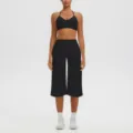 Black halter sports bra and high-waisted capri yoga pants activewear set for women fitness. - S / Top And Bottom / Black