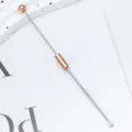 Professional metal ear pick removal tool with rose gold bead and sliding tube for daily ear care. - Electroplated Rose Gold