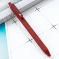 Red spray-painted minimalist ballpoint pen with matte finish and stylish metal clip detail. - Retro Copper