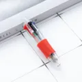 Mini 4-color ballpoint pen with clear plastic barrel, red grip, and multi-color push buttons. - Red