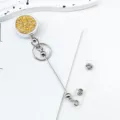 Round retractable badge reel with gold glitter, metal chain, and clear strap for ID cards. - Gold