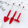 Mini red gardening tool set for succulent potted plants, includes small trowels and a cute rake. - Red