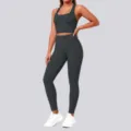 Detail view of the seamless athletic crop top and high waist yoga leggings set in dark gray. - Graphite Grey