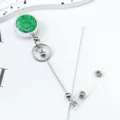 Retractable badge reel with green glitter design, perfect for nurses, doctors and ID cards. - Green