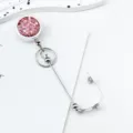 Retractable badge reel with pink glitter design, silver metal casing, and ID card holder. - Lotus root pink
