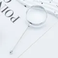 Handheld DIY beading magnifying glass with a sleek silver handle for clear daily reading. - Silver