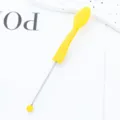 Yellow silicone blackhead brush and multi-functional lip brush facial cleaning tool. - Yellow