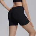 Detail view of black seamless high waist V-waist yoga shorts, peach lift fitness activewear. - S / Bottoms / Black