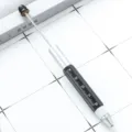 Multi-functional metal tool pen, black and silver color variant with integrated ruler scale. - Black