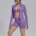 Detail view of purple seamless 3-piece fitness set featuring zip jacket, bra, and athletic shorts. - S / Set / Mist Purple