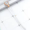 Crystal heart ballpoint pen with sparkling diamond filling and rose gold accents for office. - White with Rose Gold Parts