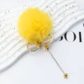 Yellow plush pom-pom keychain with gold rings and metal pin accessory for cute bag charm. - Electroplated Gold