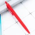 Red plastic retractable ballpoint pen, smooth writing click ball pen for office school supplies. - Red