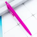 Retractable plastic ballpoint pen in vibrant magenta, smooth writing tool for office or school. - Rose Red