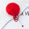 Red fluffy pom pom keychain plush ball key ring variant featuring metal pin decoration. - Bright Red