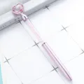Pink crystal heart ballpoint pen with sparkly rhinestones in transparent barrel for office use. - Violet