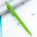 Green plastic retractable ballpoint pen, smooth writing office and school stationery tool. - Grass Green