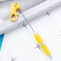 Yellow portable telescopic keychain pen, mini retractable ballpoint pen for office or gift. - Macaron Yellow