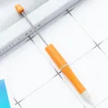 Orange wheat straw DIY beadable pen with metal rod for creative handmade jewelry craft projects. - Wheat Straw Orange